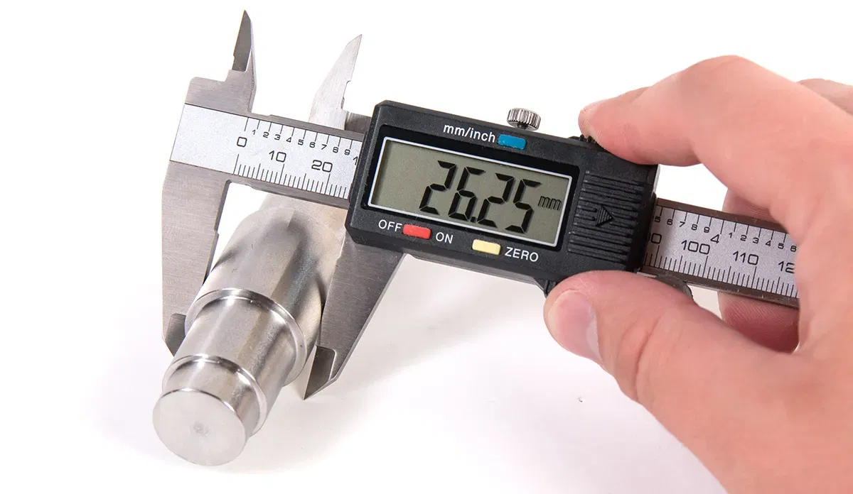 Digital caliper measuring metal part Digital caliper measuring metal part