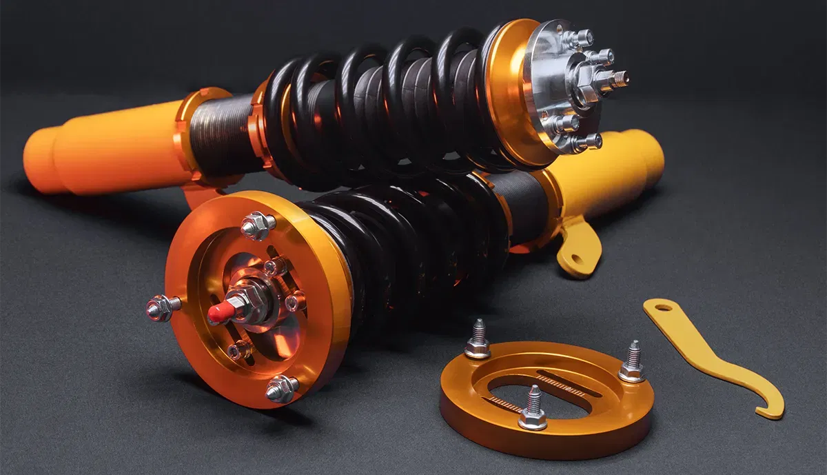 Coilover suspension with adjustment tool