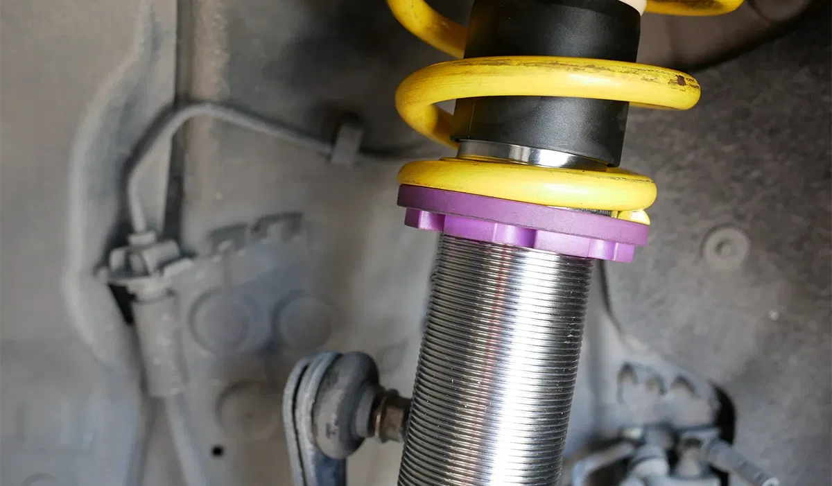 Coilover suspension with spring and adjustment ring