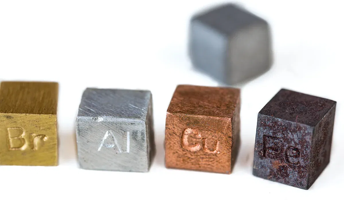 Small metal cubes with chemical symbols