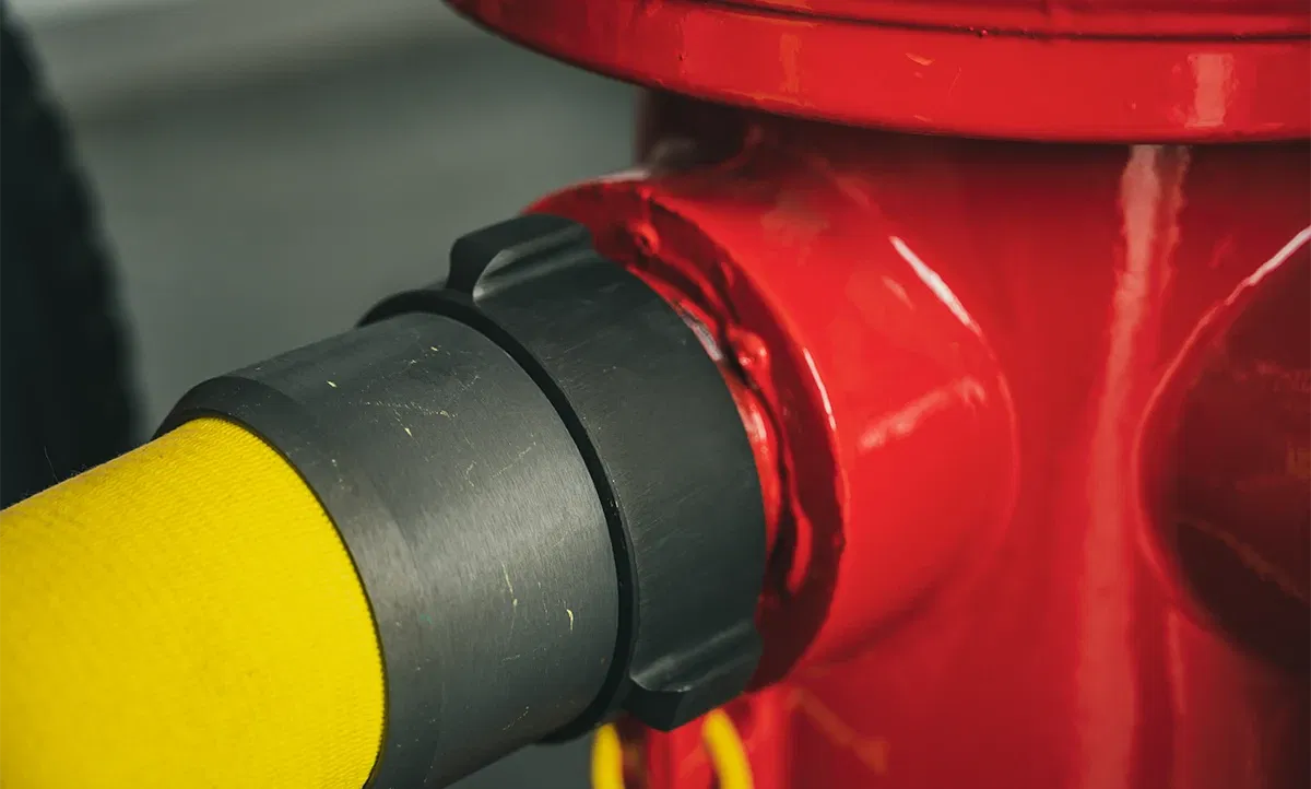 Fire hose connected to hydrant Fire hose connected to hydrant