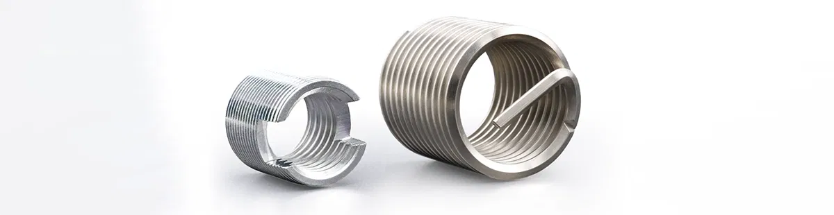 Two metal thread inserts Two metal thread inserts