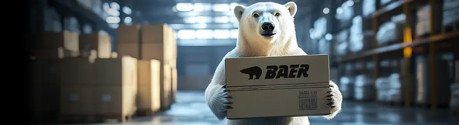 Baer Bear holds package in his hand in the warehouse