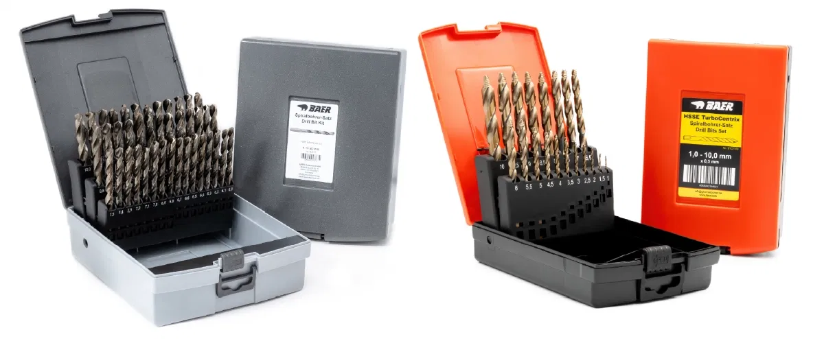 Two drill bit sets in open plastic cases
